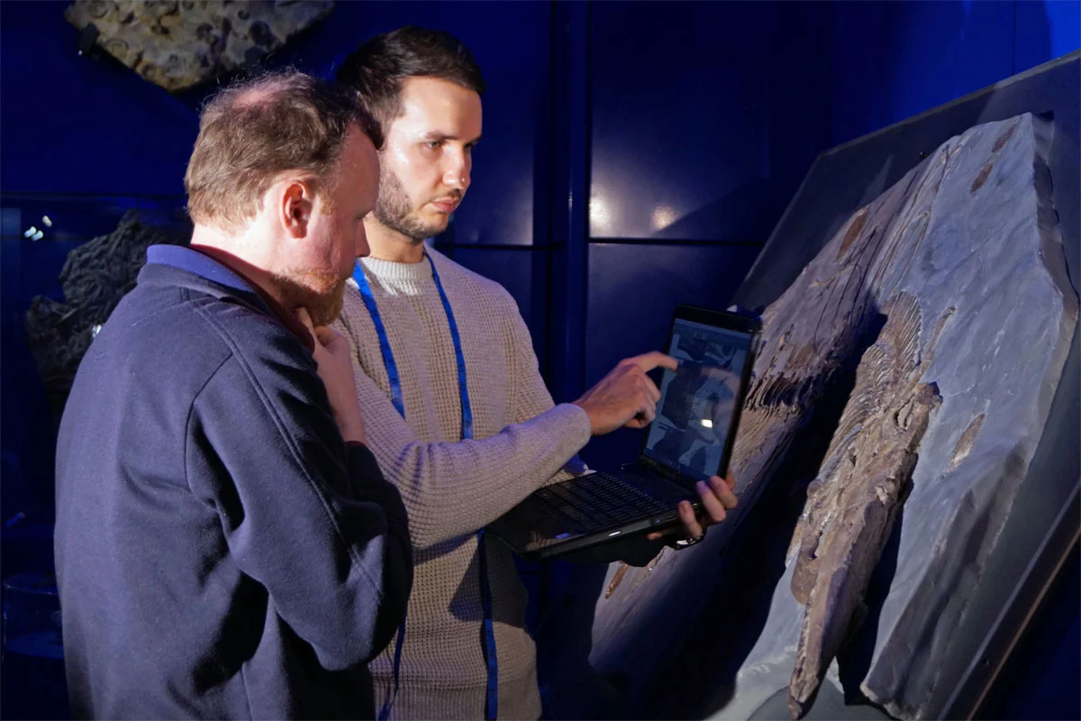 Dean Lomax and Sven Sachs carefully studying the skeleton